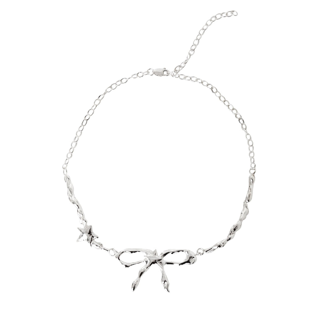 Silver necklace with branch-like design on a white background